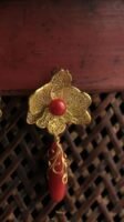 red and gold earring