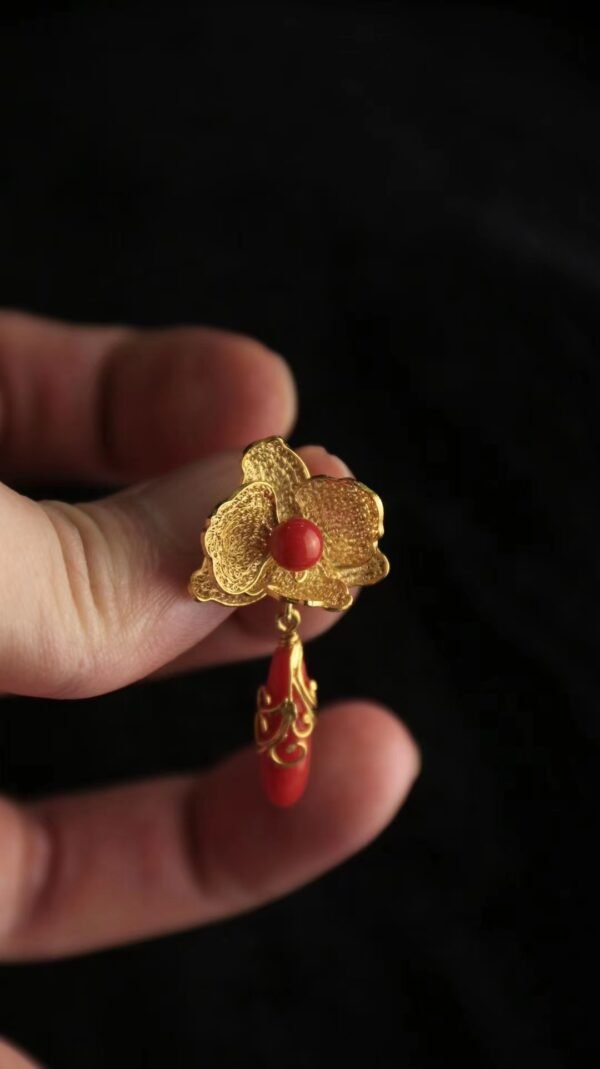 red and gold earring