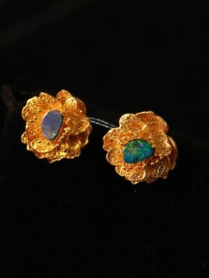 gold flower with blue heart earring