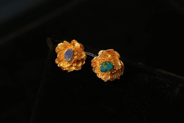 gold flower with blue heart earring