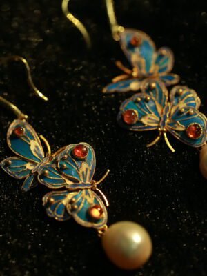 butterfly and pearl earring