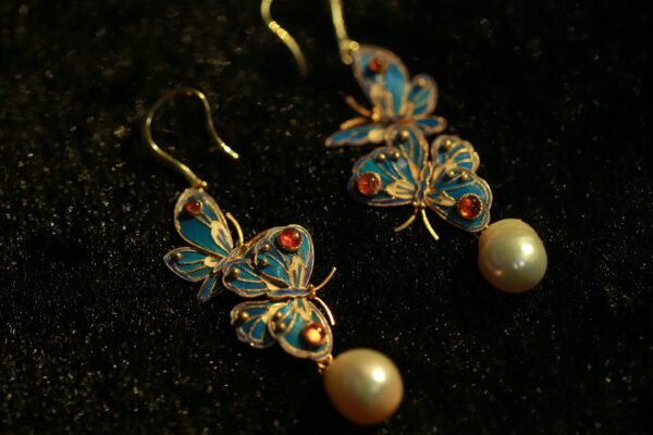 butterfly and pearl earring